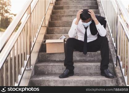 Asian Failure unemployed businessman stress sitting on stair