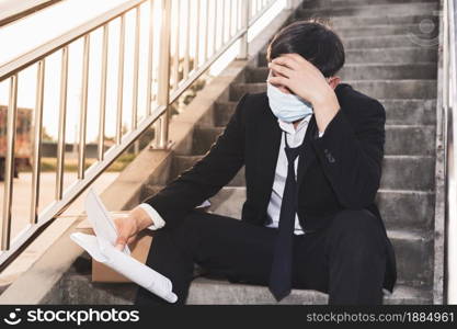 Asian Failure unemployed businessman stress sitting on stair