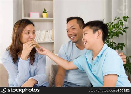 asian family enjoying snack