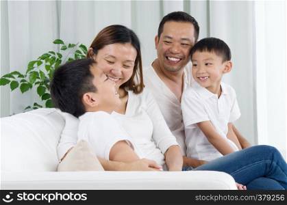 Asian family having conversation at home