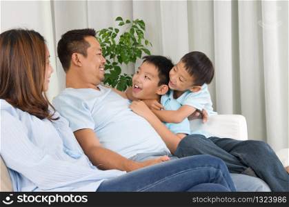 Asian family having fun at home