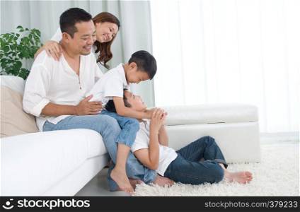 Asian family having fun at home