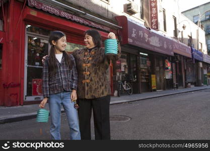 Asian family in front of store