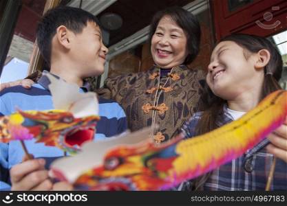Asian family in front of store