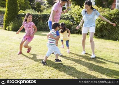 Asian Family Playing In Summer Garden Together