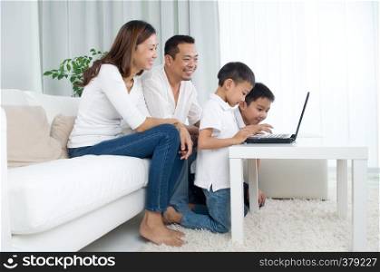Asian family using laptop