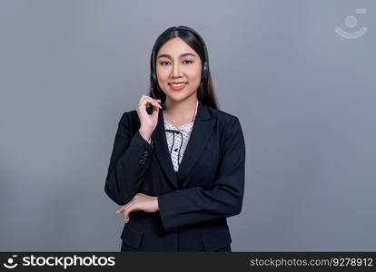 Asian female call center operator with happy smile face advertises job opportunity on empty space, wearing formal suit and headset on customizable isolated background for job recruitment. Jubilant. Attractive Asian operator with formal suit and headset. Jubilant