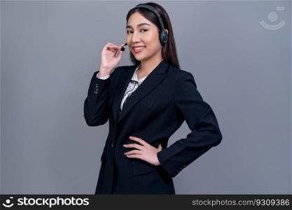 Asian female call center operator with happy smile face advertises job opportunity on empty space, wearing formal suit and headset on customizable isolated background for job recruitment. Jubilant. Attractive Asian operator with formal suit and headset. Jubilant