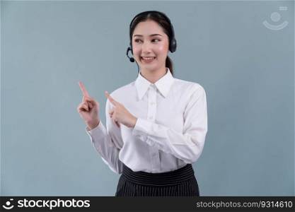 Asian female call center operator with smile face advertises job opportunity, wearing a formal suit and headset pointing finger for product on customizable isolated background. Enthusiastic. Asian operator wearing formal suit and headset with pointing finger Enthusiastic