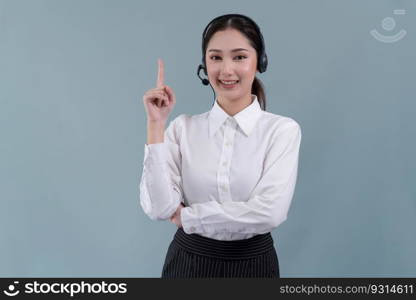 Asian female call center operator with smile face advertises job opportunity, wearing a formal suit and headset pointing finger for product on customizable isolated background. Enthusiastic. Asian operator wearing formal suit and headset with pointing finger Enthusiastic