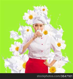 Asian female cook against milk splashes in red apron against flower background drinking milk