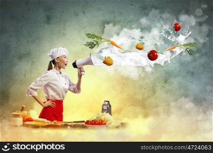 Asian female cook holding megaphone. Asian female cook screaming loud in megaphone