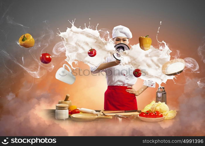 Asian female cook holding megaphone. Asian female cook screaming loud in megaphone