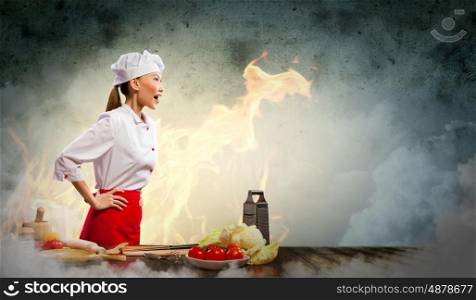 Asian female cook in anger. Asian female cook in anger against color background with shine effects