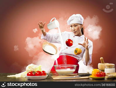 Asian female cooking with magic against color background