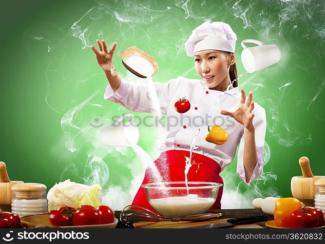 Asian female cooking with magic against color background