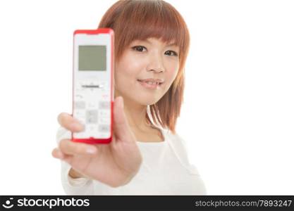 Asian female holding cordless phone