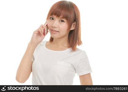 Asian female holding cordless phone