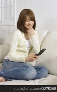 Asian female on a mobile phone