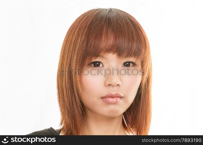 Asian female with sad expression on her face