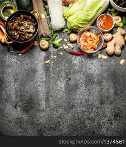 Asian food. A variety of ingredients for cooking Asian food on rustic background.