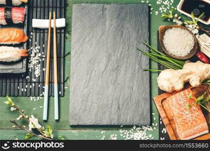 Asian food background sushi and ingredients flat lay. Asian food background sushi and ingredients, top view