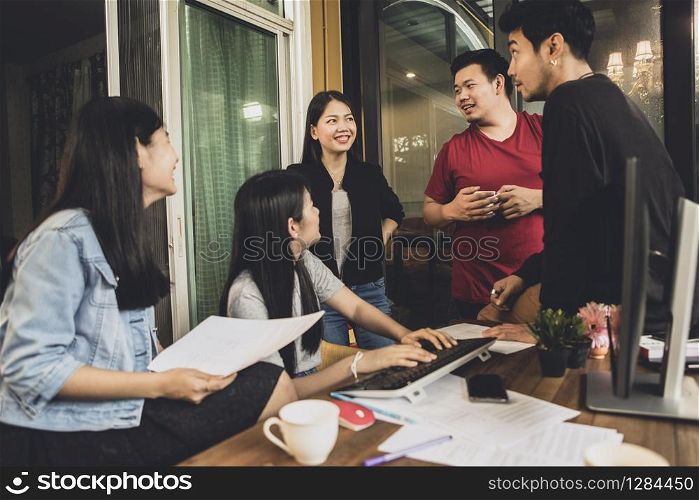 asian freelance team talking with relaxing in home office