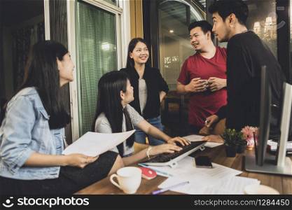 asian freelance team talking with relaxing in home office