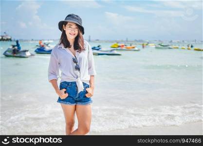 Asian girl enjoying her vacation by the sea