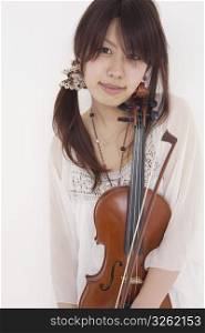 Asian girl holding violin