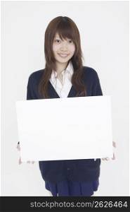 Asian girl holding white sign