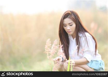 Asian girl on wheat field