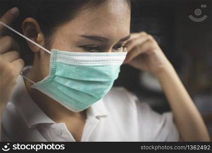 Asian girl patient wearing a medical mask for against infection and prevent spread of Coronavirus,Covid-19 prevention.
