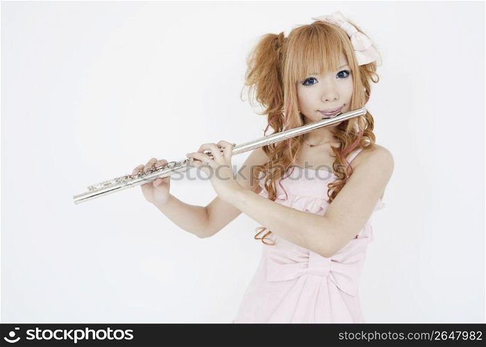 Asian girl playing the flute