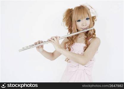 Asian girl playing the flute