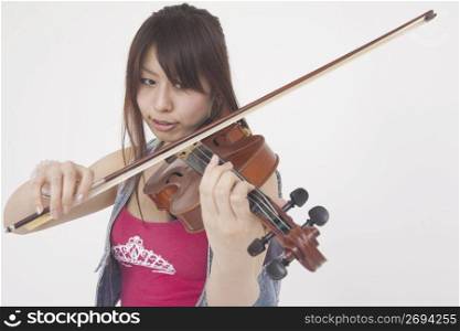Asian girl playing violin