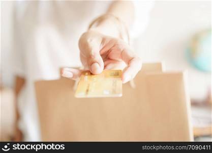 Asian girl&rsquo;s hand holding credit card for payment, Concepts for business and finance