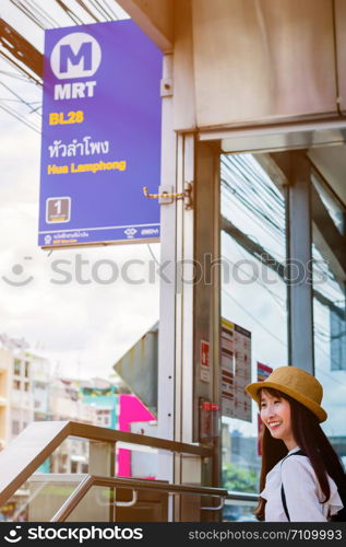 Asian girl travel by MRT subway in Bangkok Thailand.