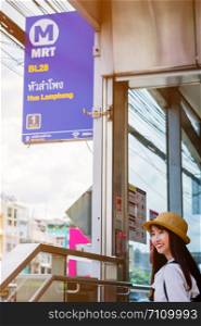 Asian girl travel by MRT subway in Bangkok Thailand.