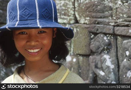 Asian Girl Wearing Hat and Smiling