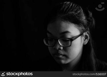 Asian girl with black and white image of background.