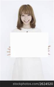 Asian girl with white sign