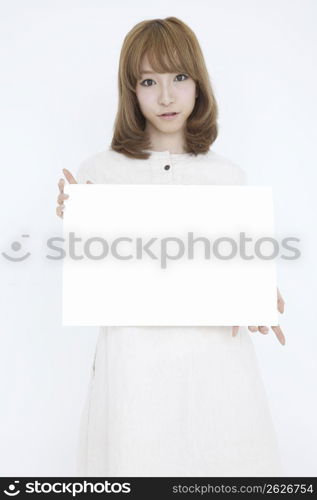 Asian girl with white sign