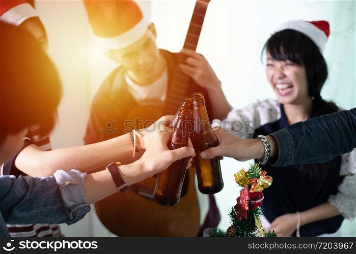 Asian group of friends having party with alcoholic beer drinks and Young people enjoying at a bar toasting cocktails
