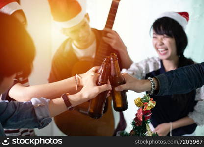 Asian group of friends having party with alcoholic beer drinks and Young people enjoying at a bar toasting cocktails