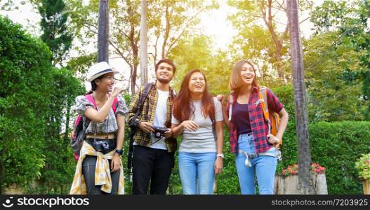 Asian Group of young people with friends backpacks walking together and happy friends are taking photo and selfie ,Relax time on holiday concept travel