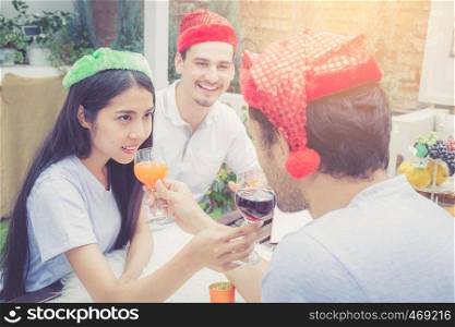 Asian group people man and woman drink and celebration at party outdoor. group of friends social event with beverage on hand with achievement, festive concept.