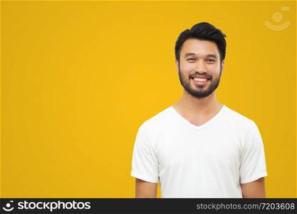 Asian handsome man with a mustache, smiling and laughing isolated on yellow background