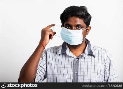 Asian happy portrait young black man wearing face mask protective from virus coronavirus epidemic or air pollution looking camera, studio shot isolated on white background, stop COVID-19 concept