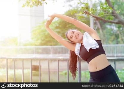 Asian healthy woman shoulder Stretching exercise outdoor morning